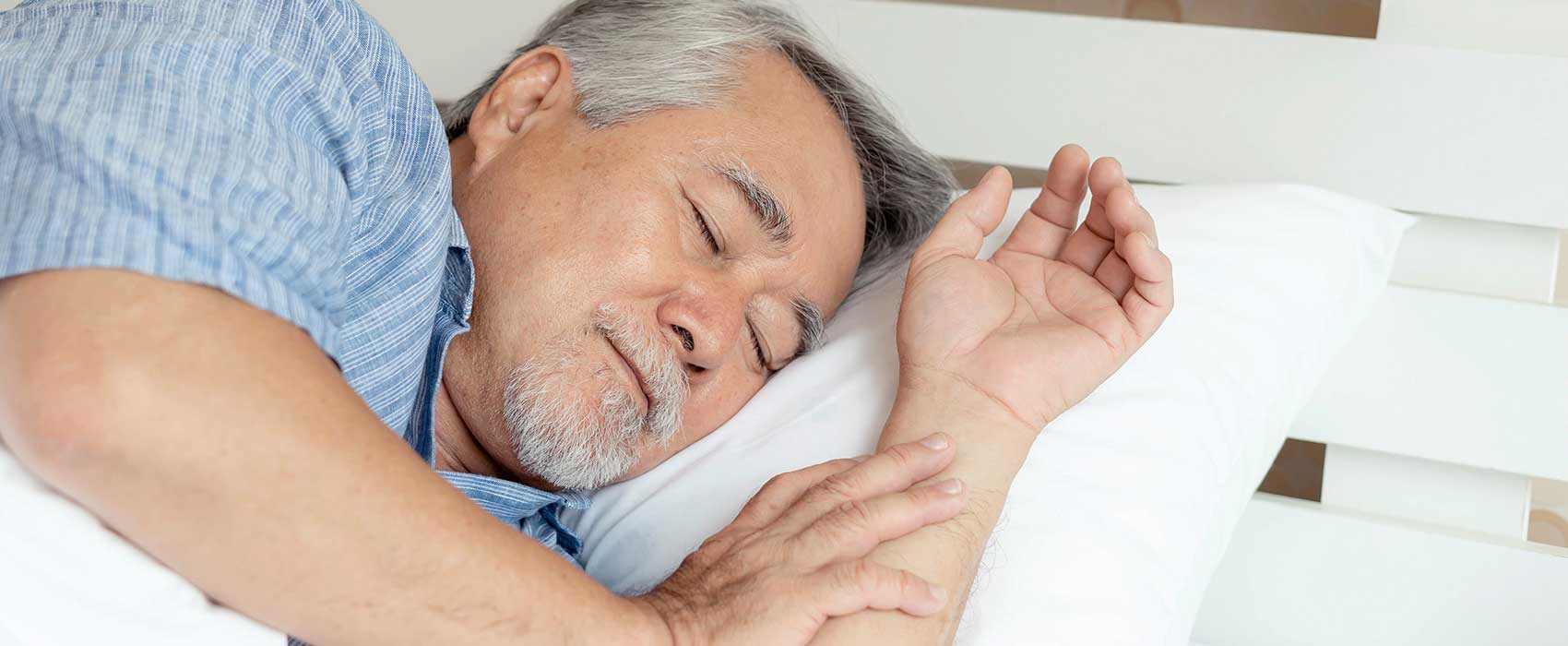 man sleeping in bed