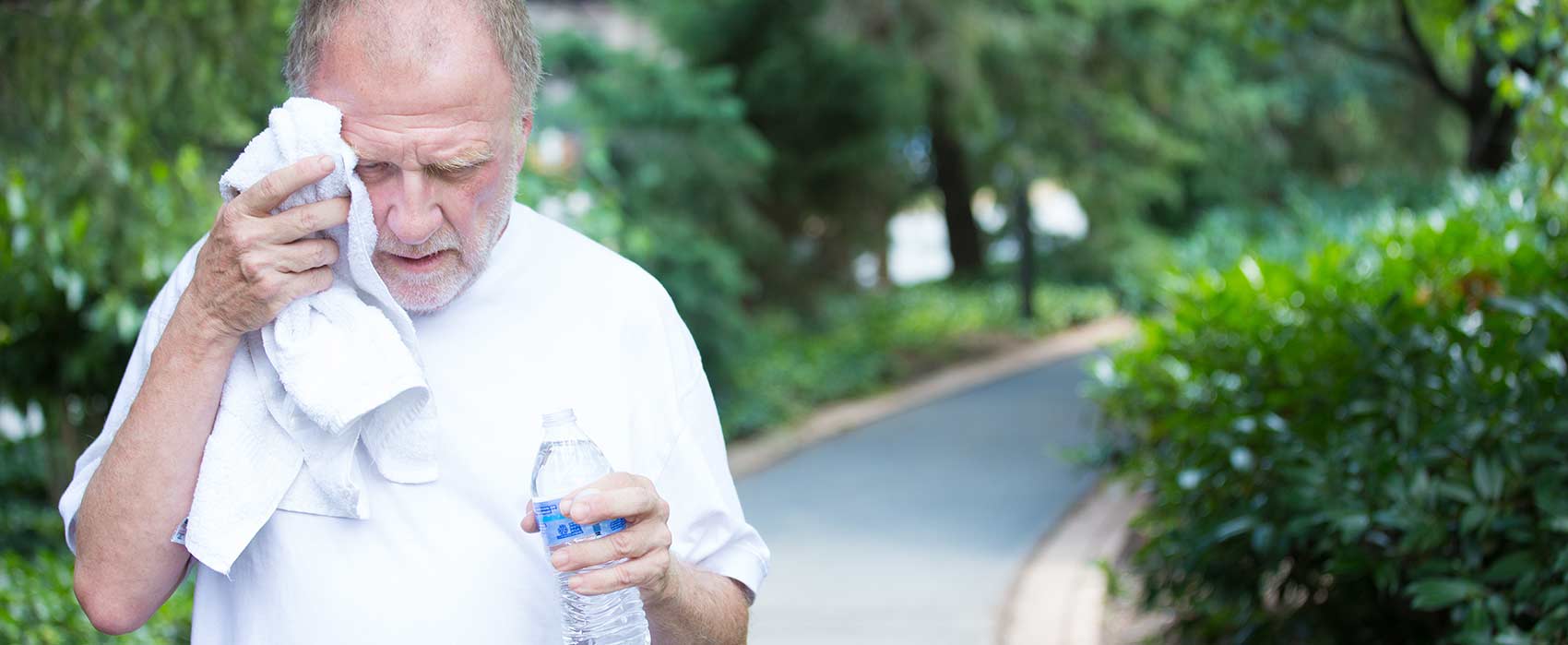 man-walking-sweating-