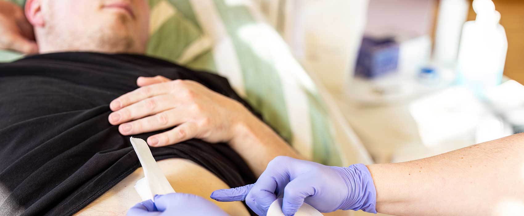 man with doctor with ostomy