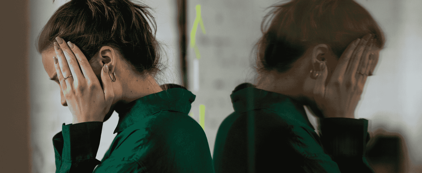 stressed woman in green shirt