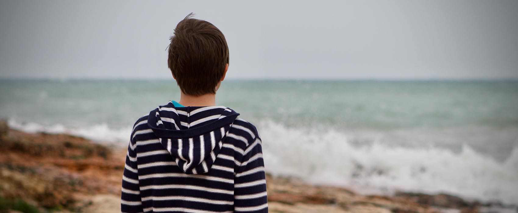 teen at shoreline