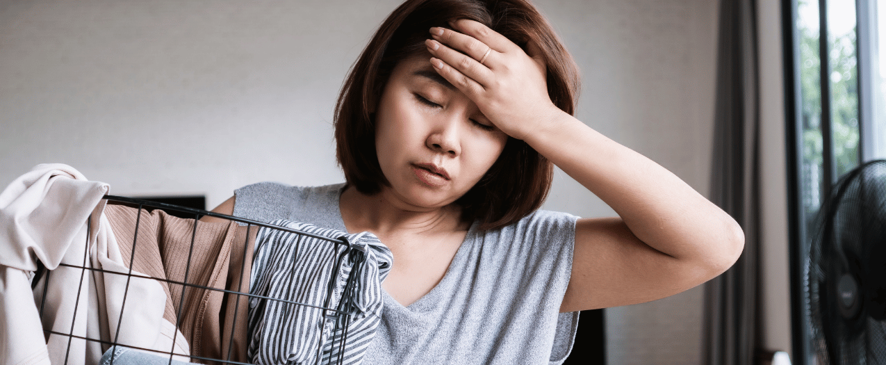 tired woman with laundry