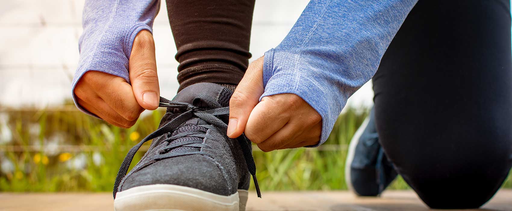 person tying sneaker