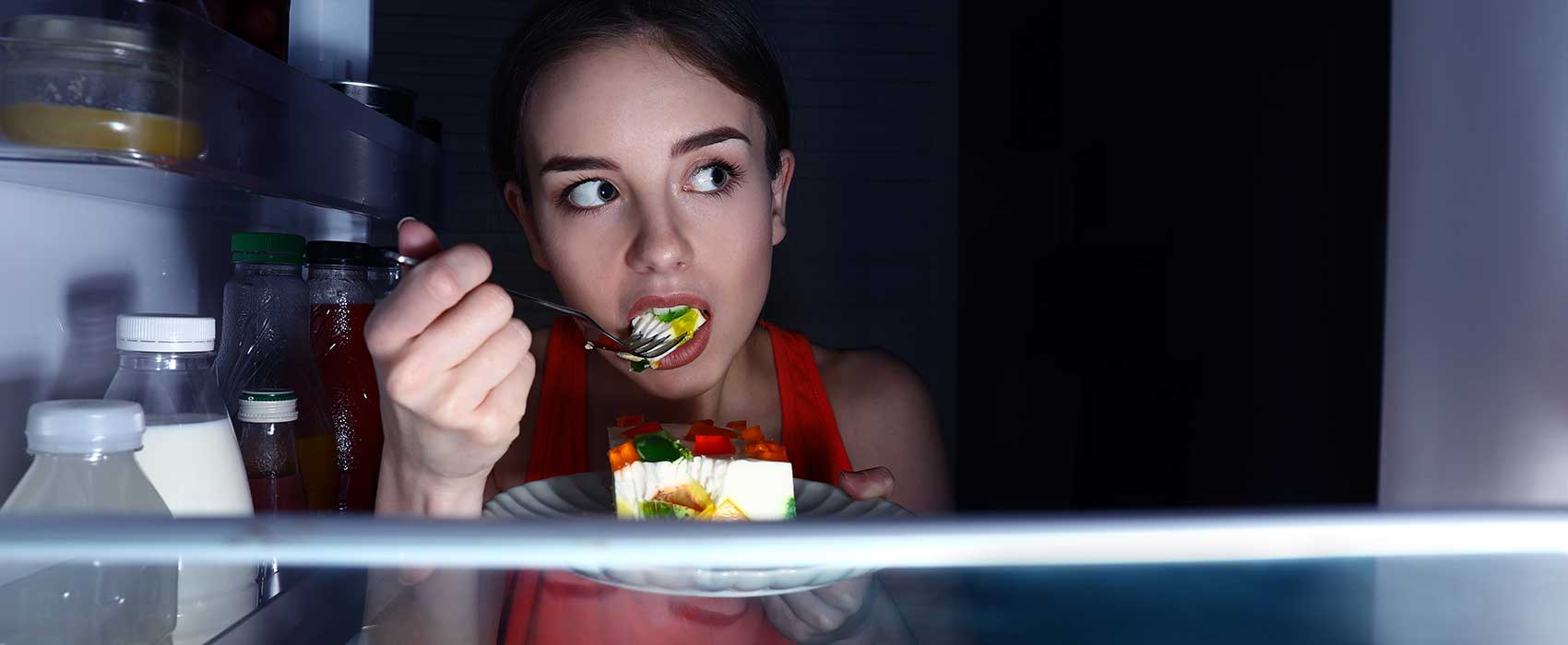 Woman at Fridge Eating at Night