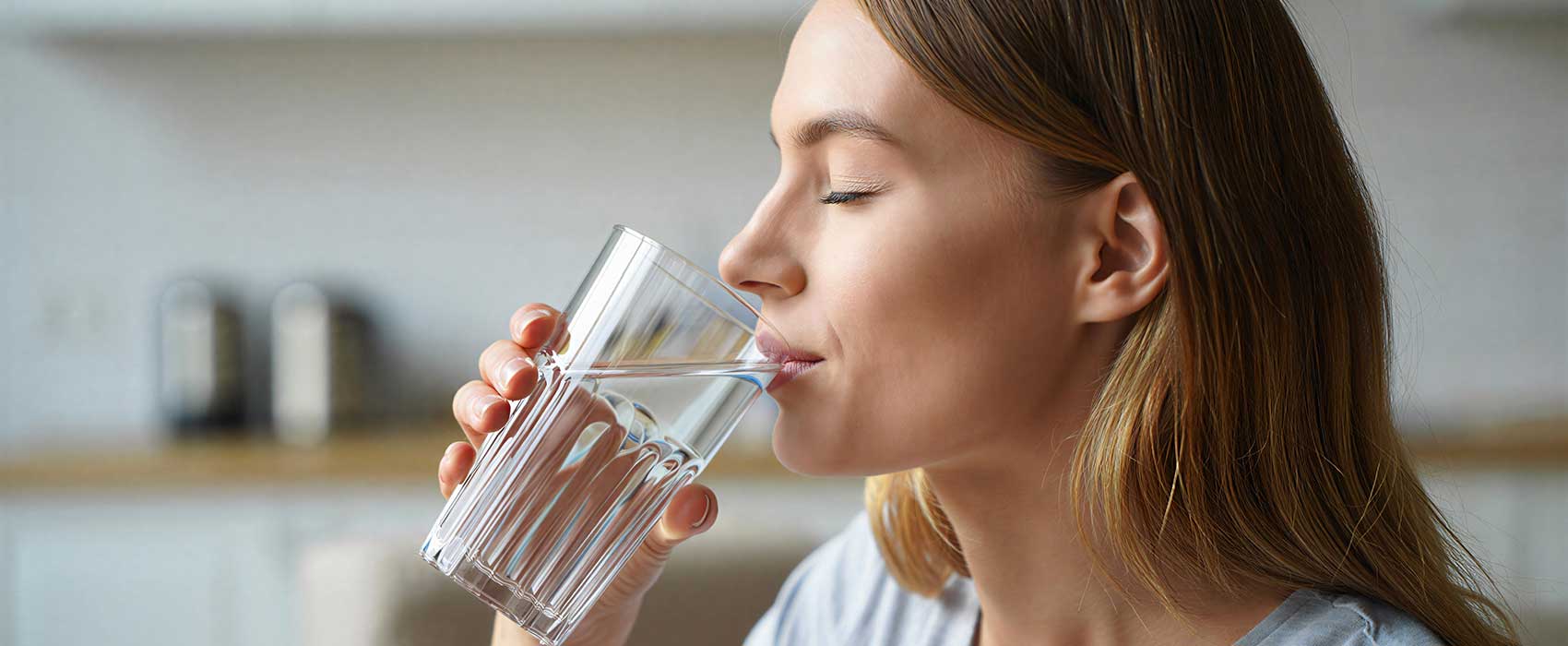 Woman Drinking Water from Glass