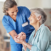 younger woman caring for older woman